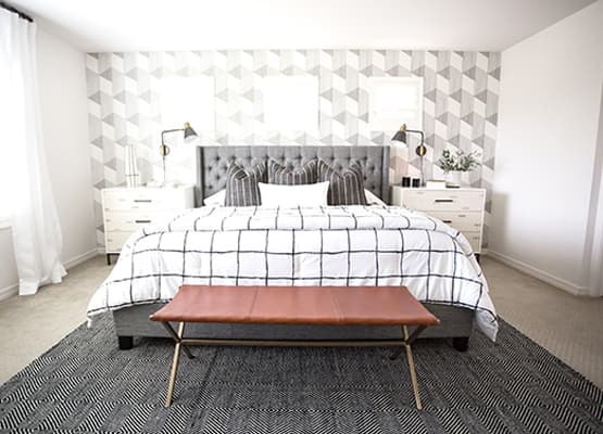 bright white room grey upholstered bed