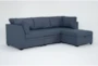 Solimar Denim Blue Fabric 4 Piece Modular Sofa & Storage Ottoman - Signature