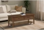 Leanor Brown Rectangle Coffee Table With Wheels + Storage Drawers - Room